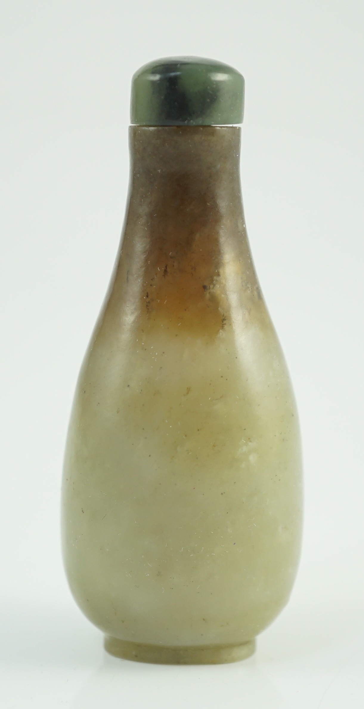 A Chinese celadon and brown jade pear form snuff bottle, 19th century, 7.2cm high